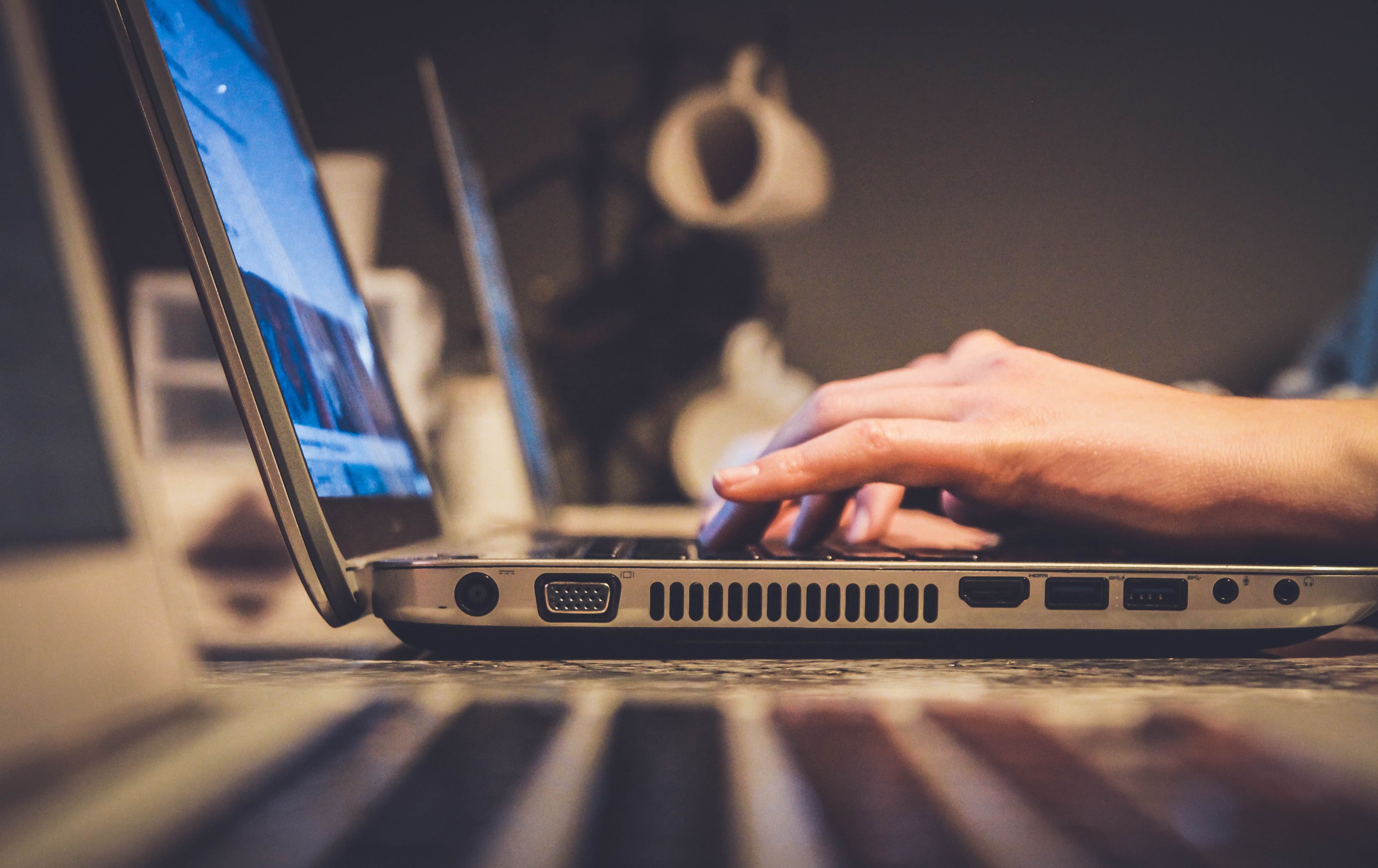 Image of a person writing on a keyboard
